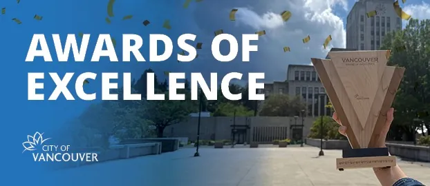 City of Vancouver “Awards of Excellence” banner shows a wooden trophy held outside City Hall.
