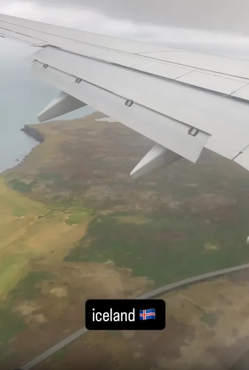 An aeroplane wing passes over Icelandās coastline during the approach to KeflavĆk International Airport.