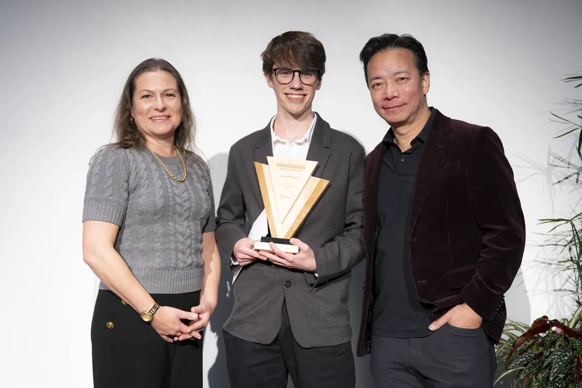 Gabriel holds his Impact in Innovation Award between Councillor Lisa Dominato and Mayor Ken Sim.