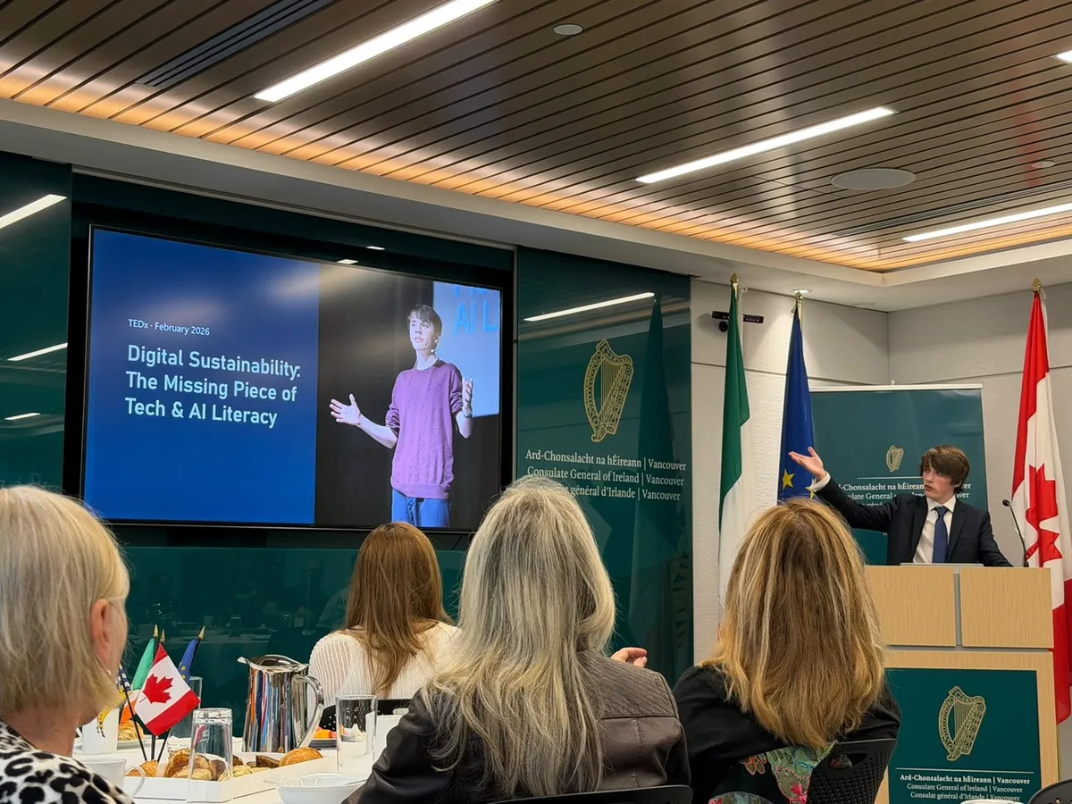 Gabriel addresses the Irish Consulate breakfast audience beside a slide about his TEDx talk on digital sustainability.